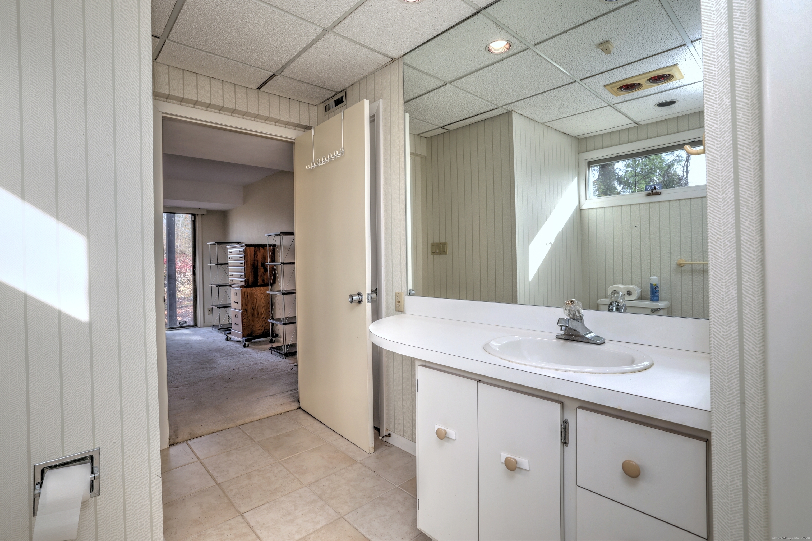 70 Woodfield Road Woodbridge, CT 06525 - Photo 32 of 37 a en suite bathroom with a sink and mirror