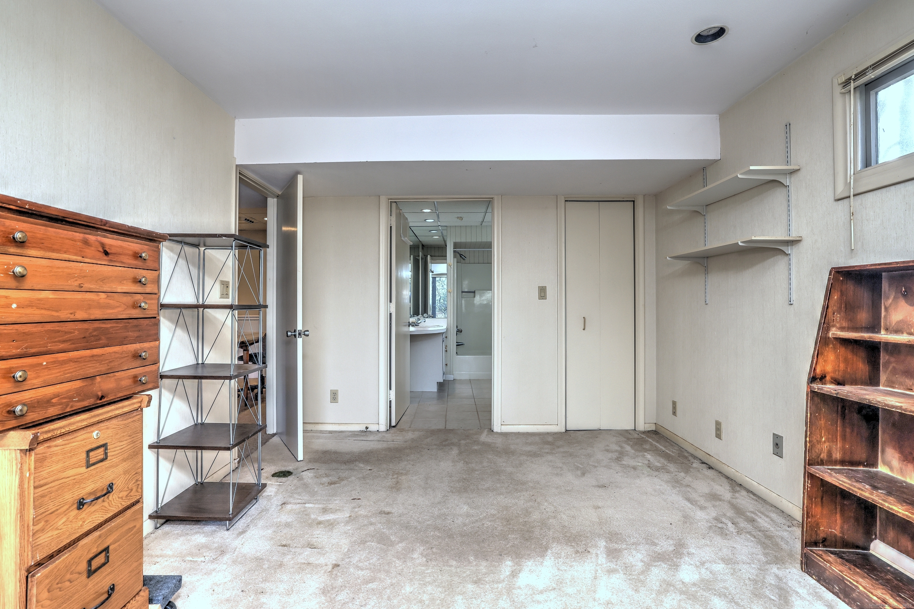 70 Woodfield Road Woodbridge, CT 06525 - Photo 33 of 37 a view of walk in closet with clothes and shoes