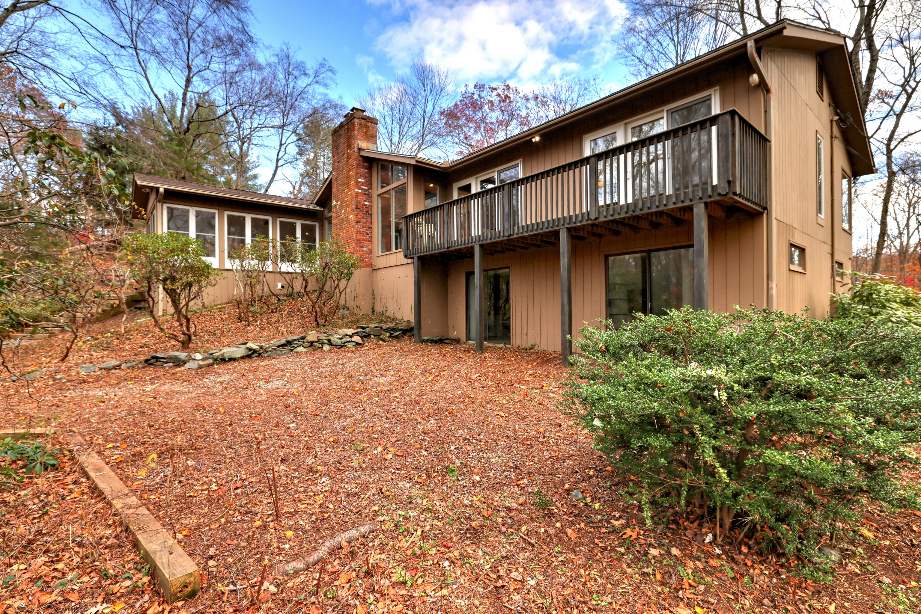 70 Woodfield Road Woodbridge, CT 06525 - Photo 36 of 37 a view of a house with a yard