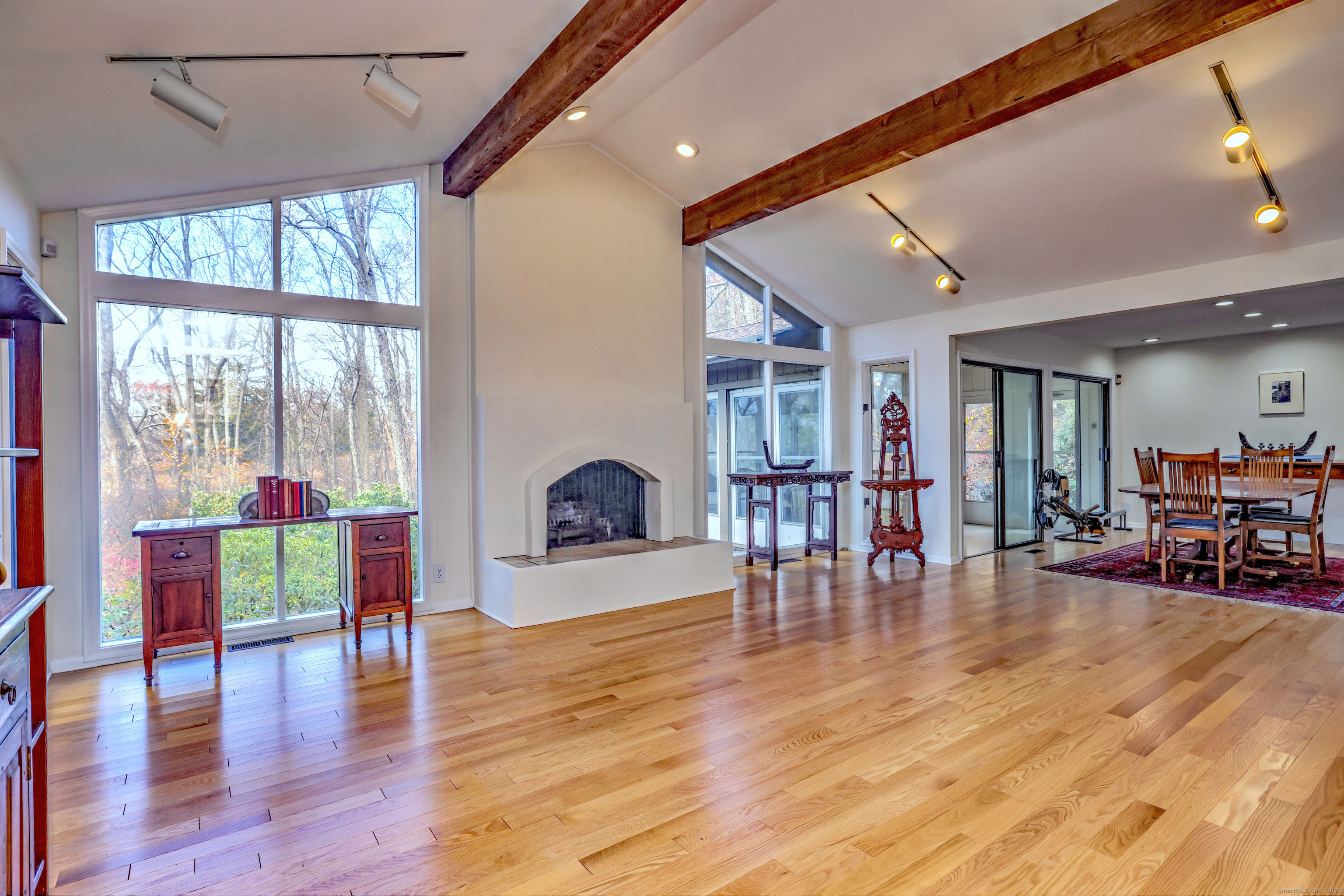 70 Woodfield Road Woodbridge, CT 06525 - Photo 4 of 37 a living room with furniture and a floor to ceiling window