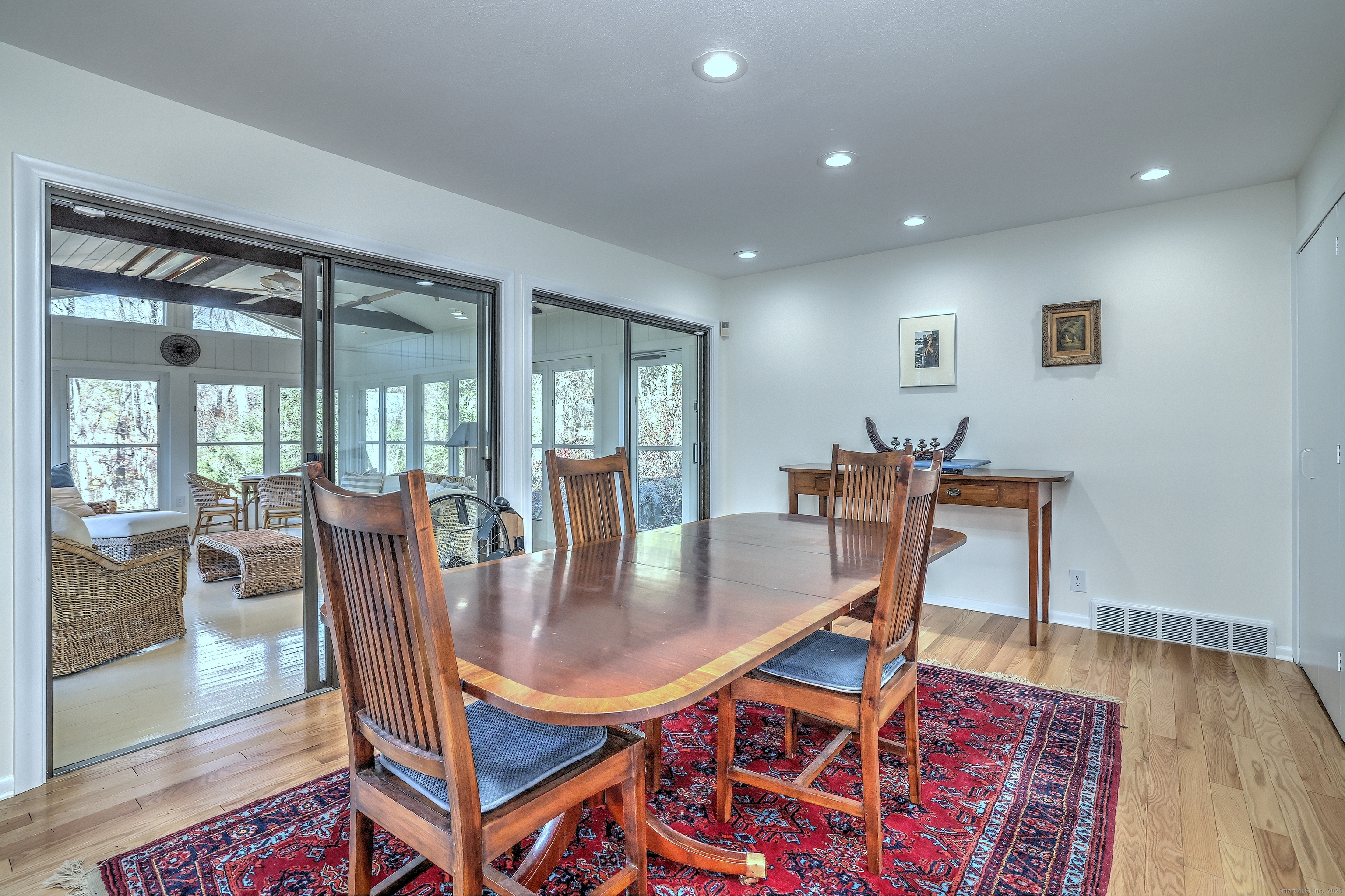 70 Woodfield Road Woodbridge, CT 06525 - Photo 9 of 37 a dining room with furniture and wooden floor