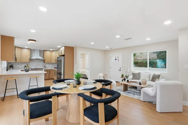 a spacious bedroom with a bed and a couch