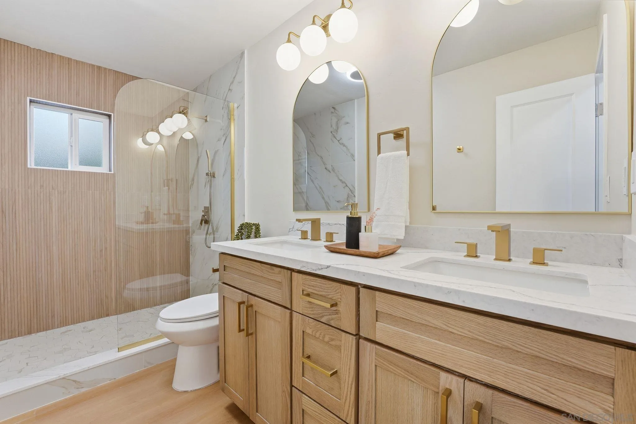 4800 Lee Avenue La Mesa, CA 91942 - Photo 25 of 60 a bathroom with a granite countertop sink a toilet and a mirror
