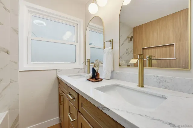 a close up of a sink and a mirror