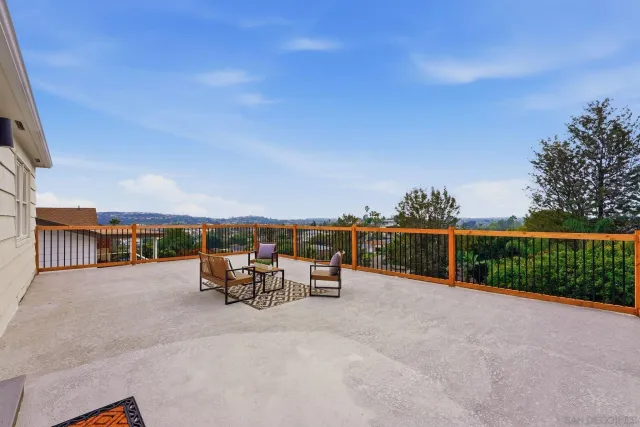 a kitchen with stainless steel appliances granite countertop a stove a refrigerator and a microwave