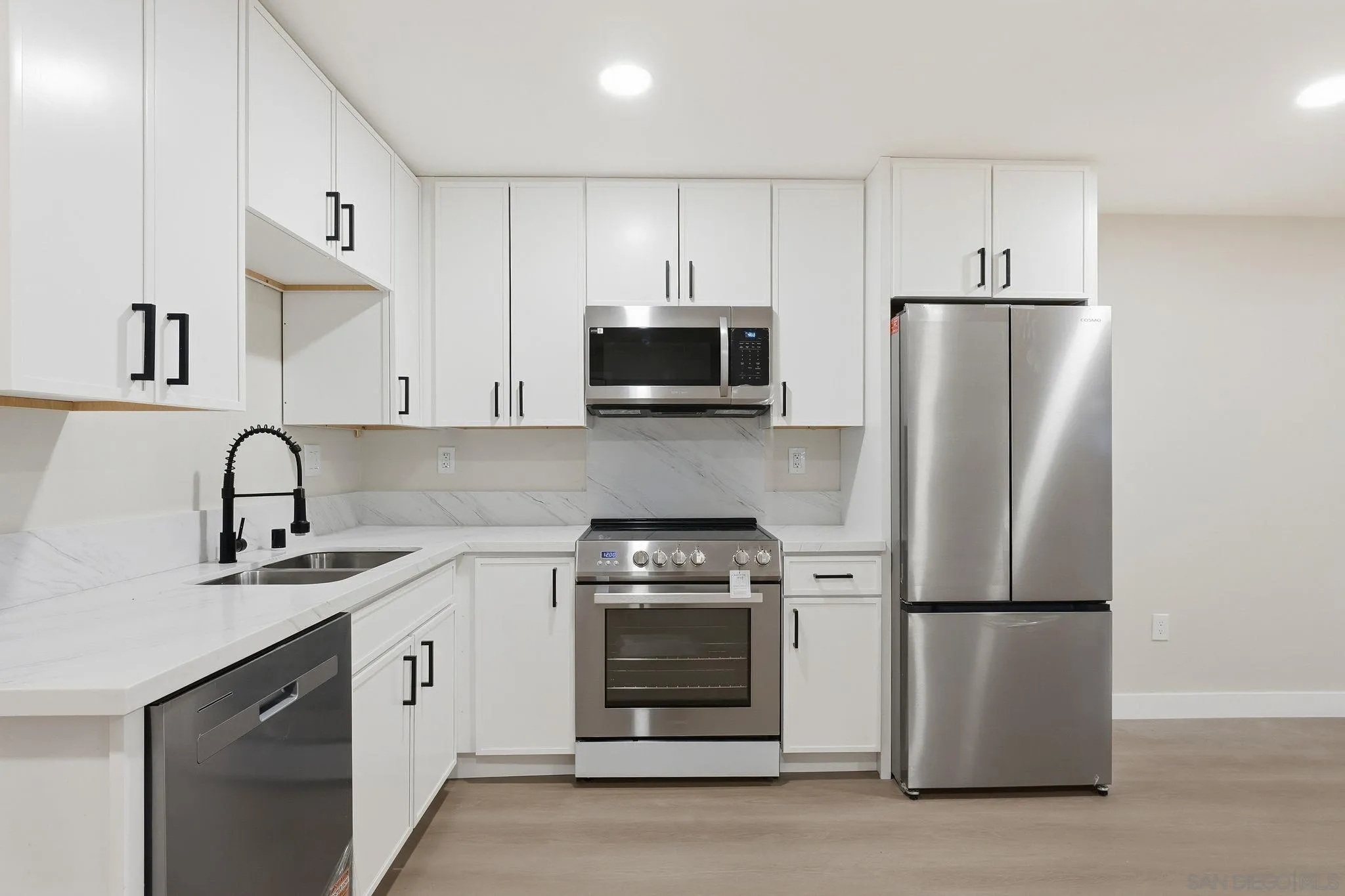 4800 Lee Avenue La Mesa, CA 91942 - Photo 36 of 60 a kitchen with stainless steel appliances granite countertop a stove a refrigerator and a microwave
