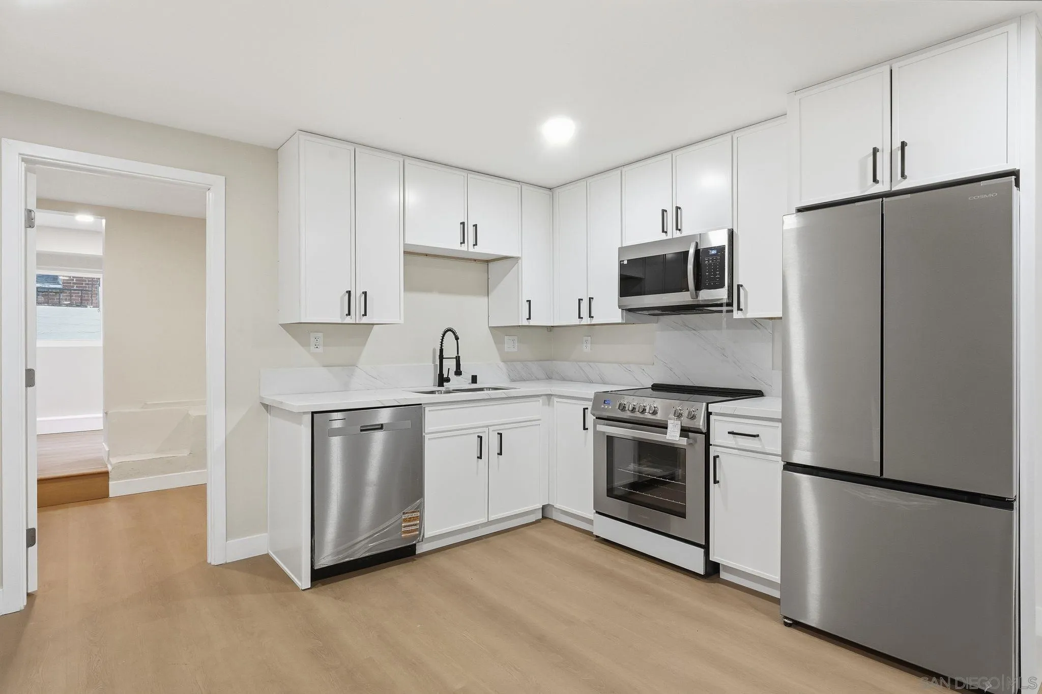 4800 Lee Avenue La Mesa, CA 91942 - Photo 37 of 60 a kitchen with stainless steel appliances granite countertop a refrigerator stove a sink and microwave