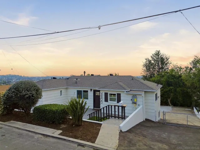 a backyard of a house with lots of green space