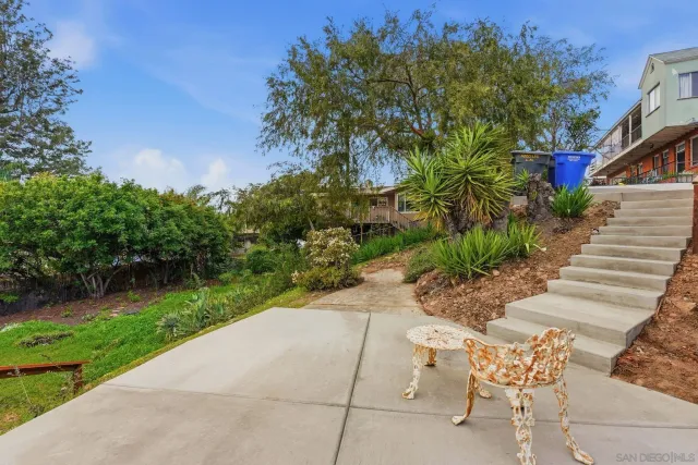 an aerial view of residential building with parking