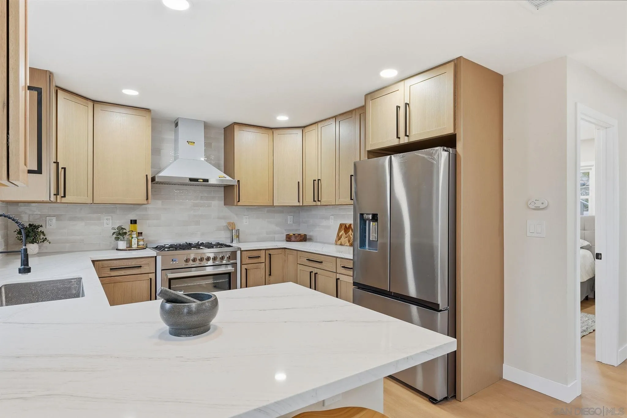 4800 Lee Avenue La Mesa, CA 91942 - Photo 9 of 60 a kitchen with stainless steel appliances granite countertop a refrigerator a stove a sink a microwave and a refrigerator