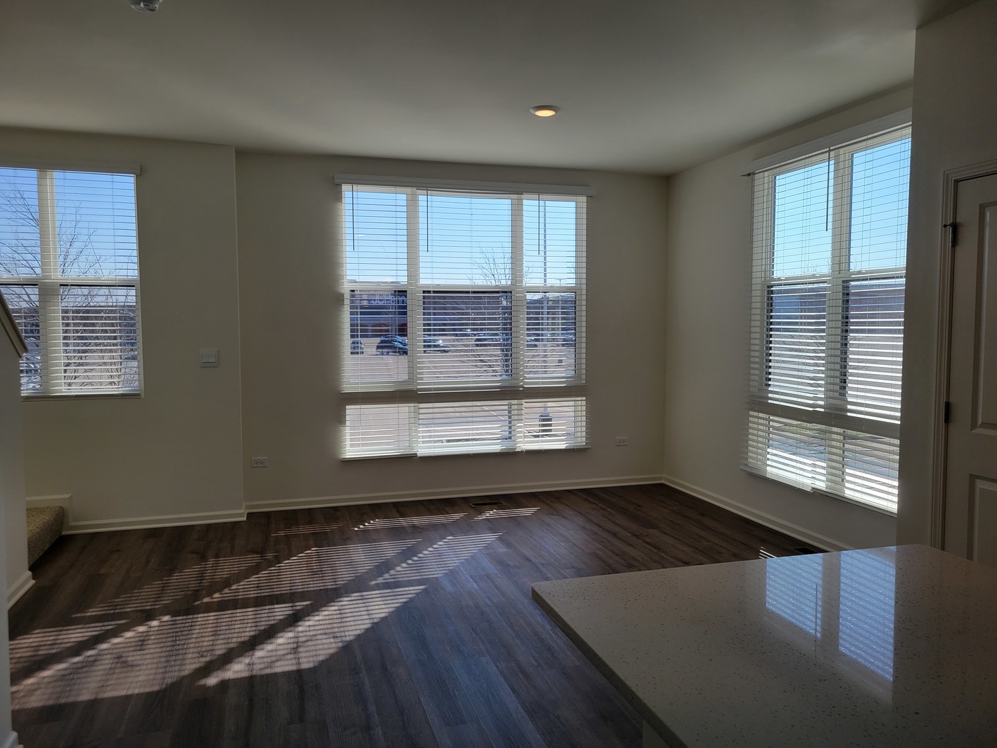 332 Summit Circle Lombard, IL 60148 - Photo 4 of 13 a view of an empty room with wooden floor and a window