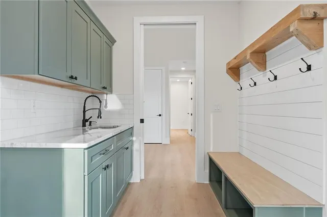 a kitchen with a sink and cabinets