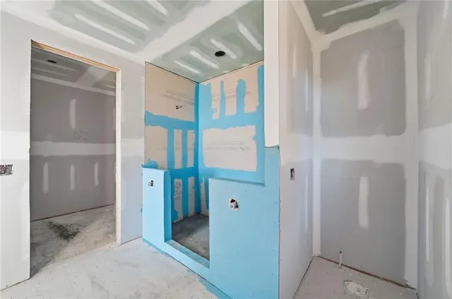 a view of a living room and kitchen