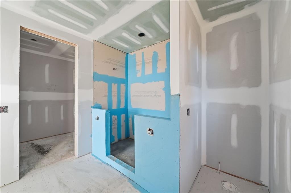 1783 Hunter Drive Ranger, GA 30734 - Photo 25 of 40 a bathroom with a shower and a glass door