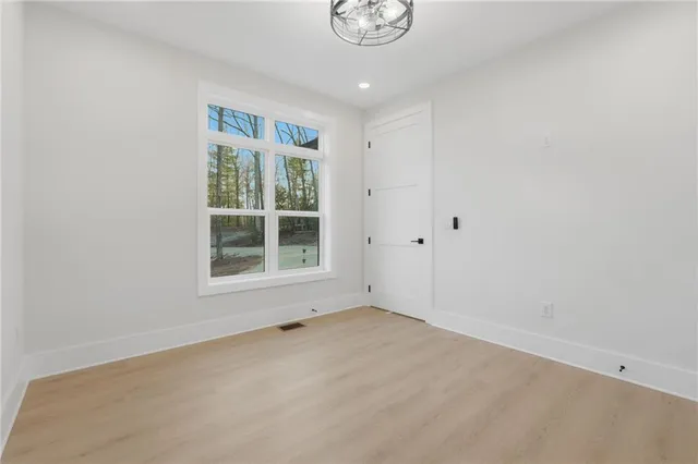 a bathroom with a granite countertop sink a toilet and shower