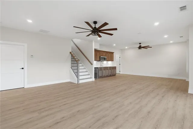 a kitchen with sink cabinets and stainless steel appliances