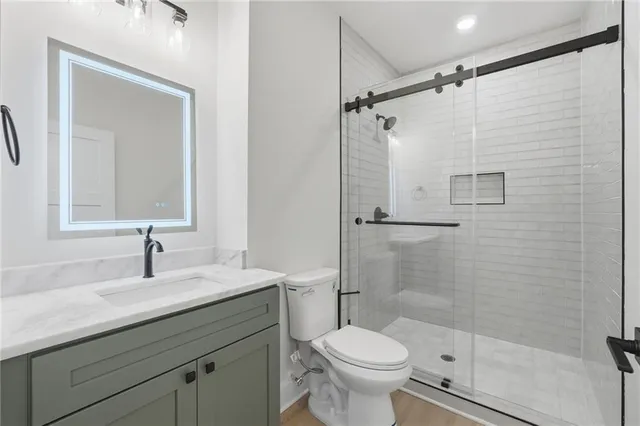 an empty room with wooden floor and a window