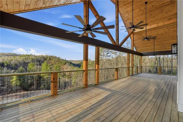 a view of a balcony next to a yard