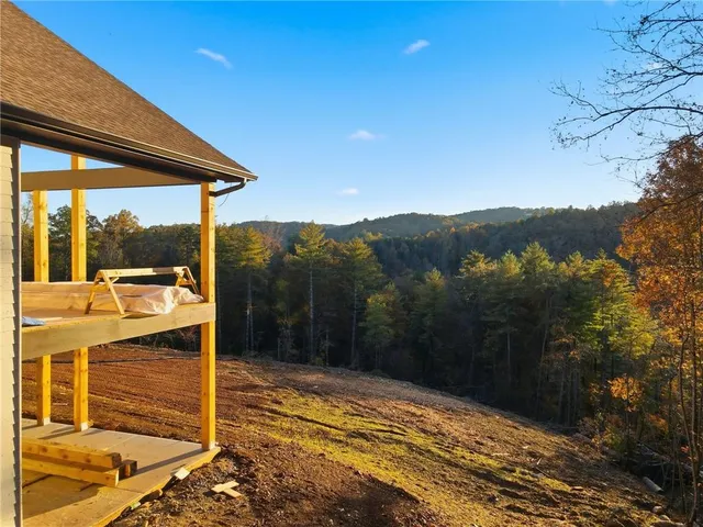a view of balcony with yard