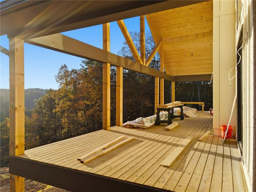 1783 Hunter Drive Ranger, GA 30734 - Photo 7 of 40 a bedroom with a bed and wooden floor