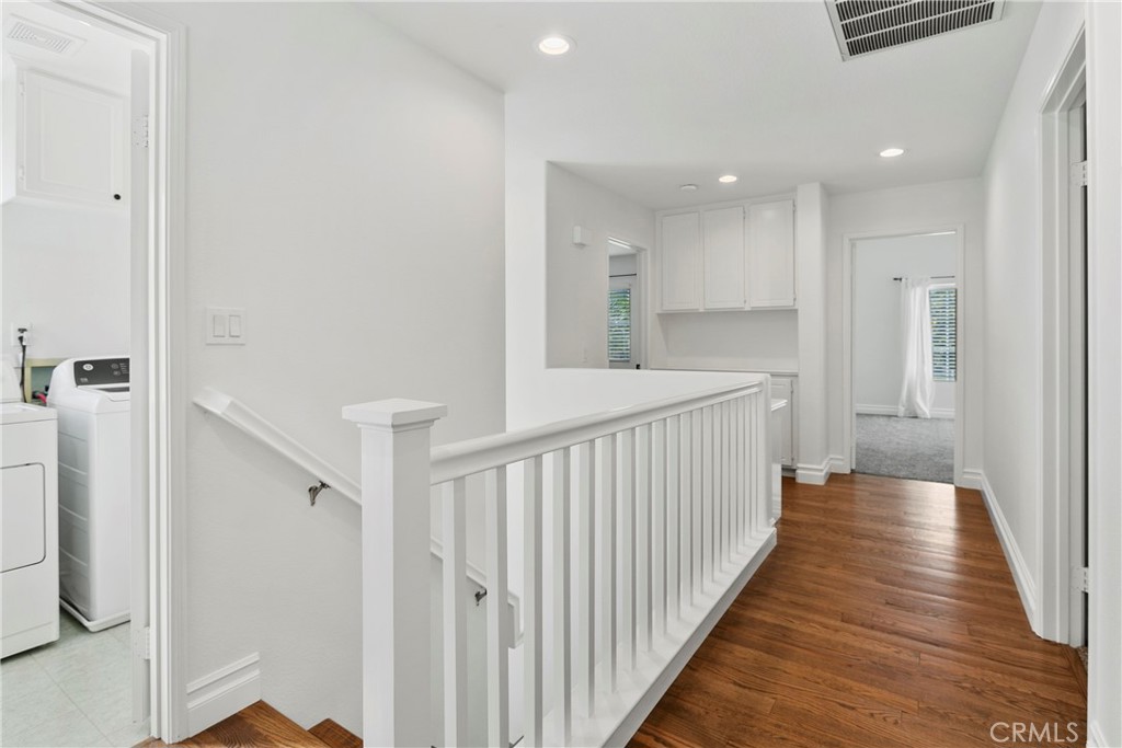 81 Plateau Aliso Viejo, CA 92656 - Photo 12 of 31 a view of a hallway with wooden floor and staircase