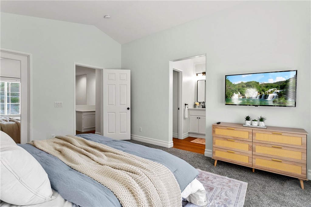 81 Plateau Aliso Viejo, CA 92656 - Photo 15 of 31 a bedroom with a bed and a flat screen tv