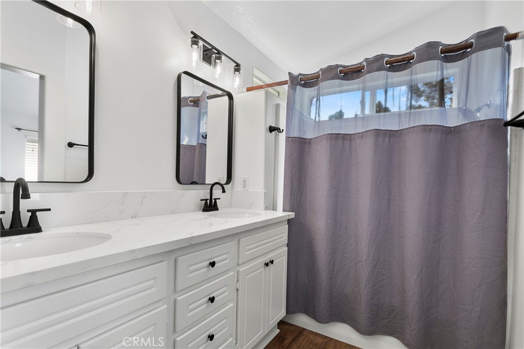 81 Plateau Aliso Viejo, CA 92656 - Photo 21 of 31 a bathroom with a double vanity sink and mirror