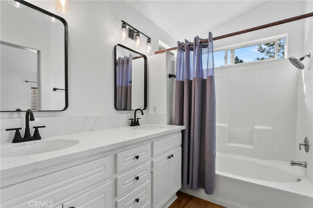 81 Plateau Aliso Viejo, CA 92656 - Photo 22 of 31 a bathroom with a double vanity sink mirror and shower