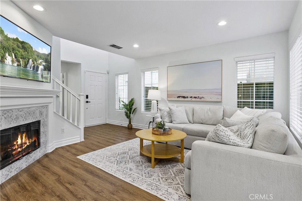 81 Plateau Aliso Viejo, CA 92656 - Photo 3 of 31 a living room with furniture and a fireplace