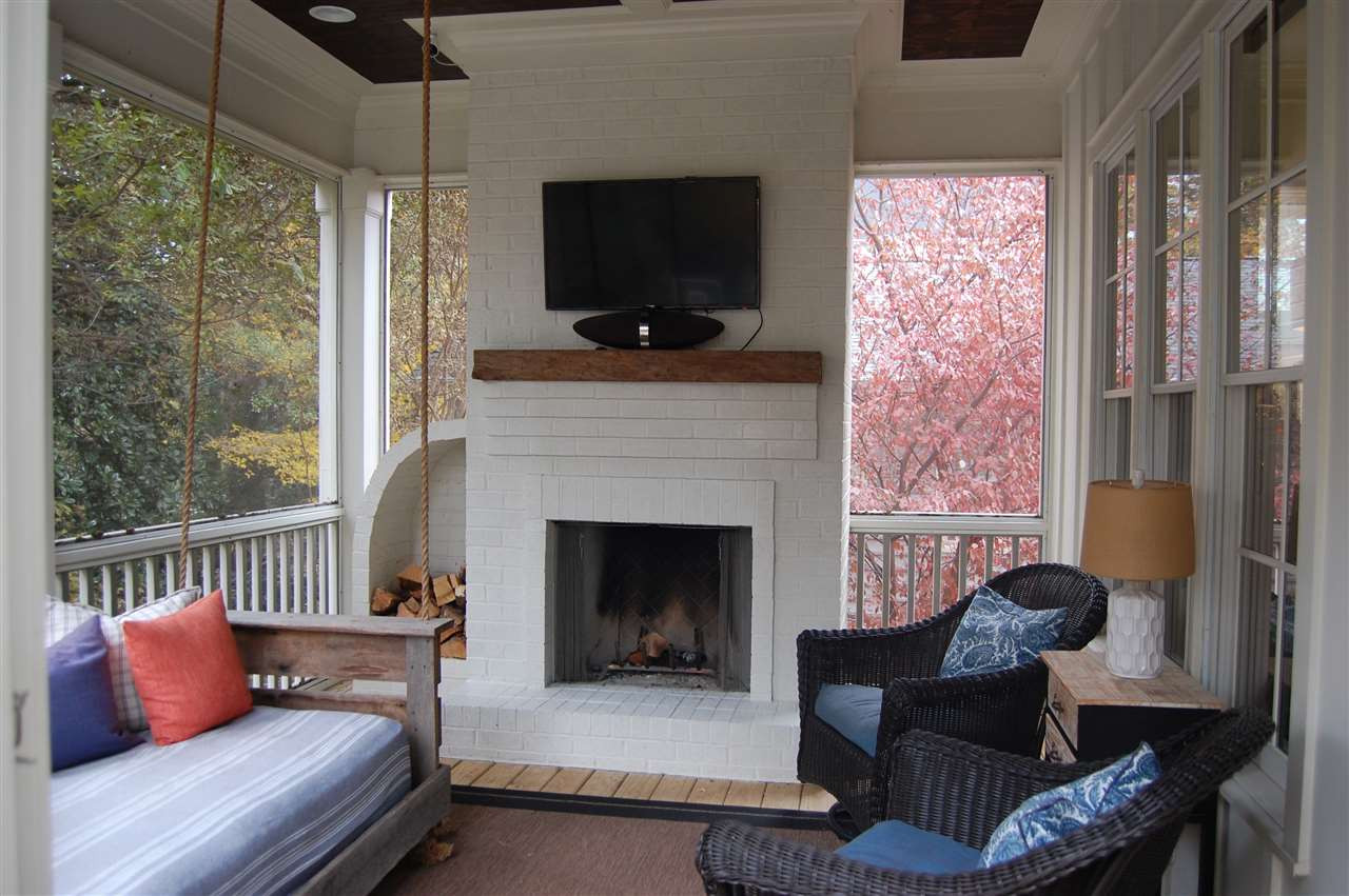 2620 Davis Street Raleigh, NC 27608 - Photo 27 of 28 Enjoy the beautiful magnolia trees and private backyard from this lovely screened porch. Screened Porch