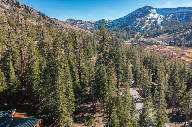 a view of a town with mountains in the background