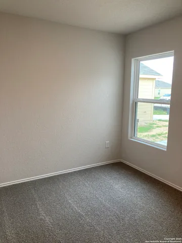 an empty room with a empty space and window