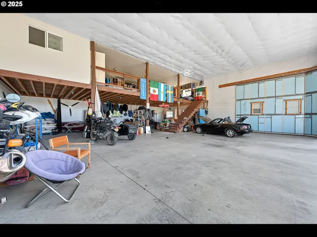 a living room with lots of furniture and a chandelier