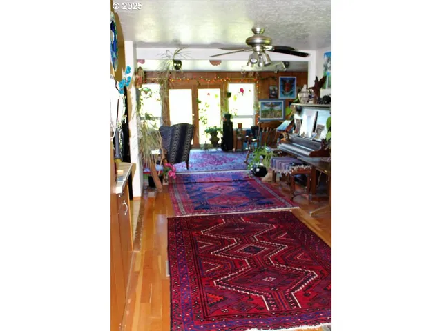 a picture of a living room with a rug