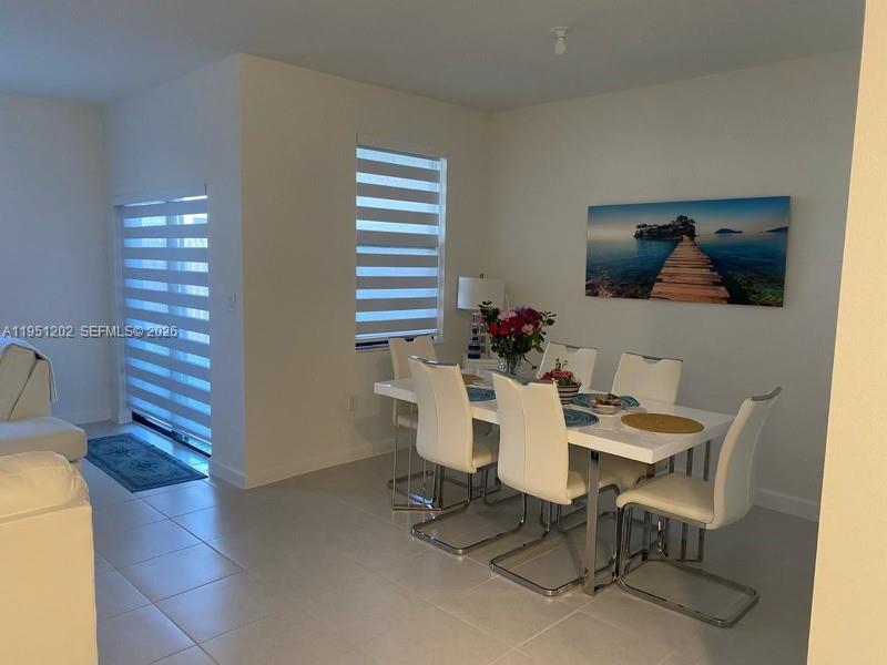 13101 Southwest 286th Street Homestead, FL 33033 - Photo 4 of 5 a dining room with furniture and window
