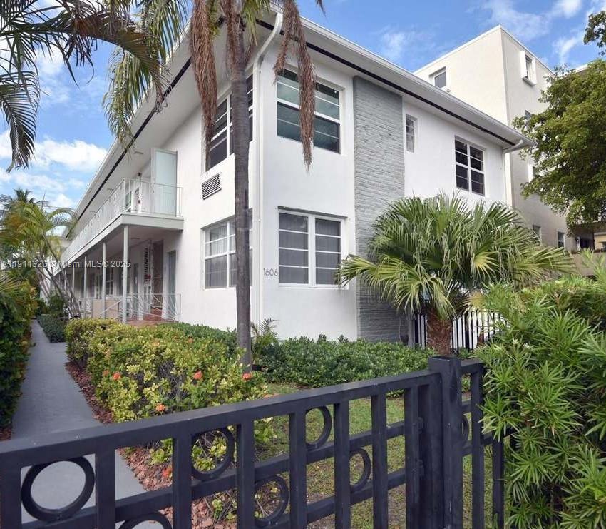 a view of a house with a flower garden