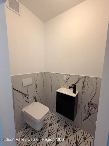 a bathroom with a toilet and a sink