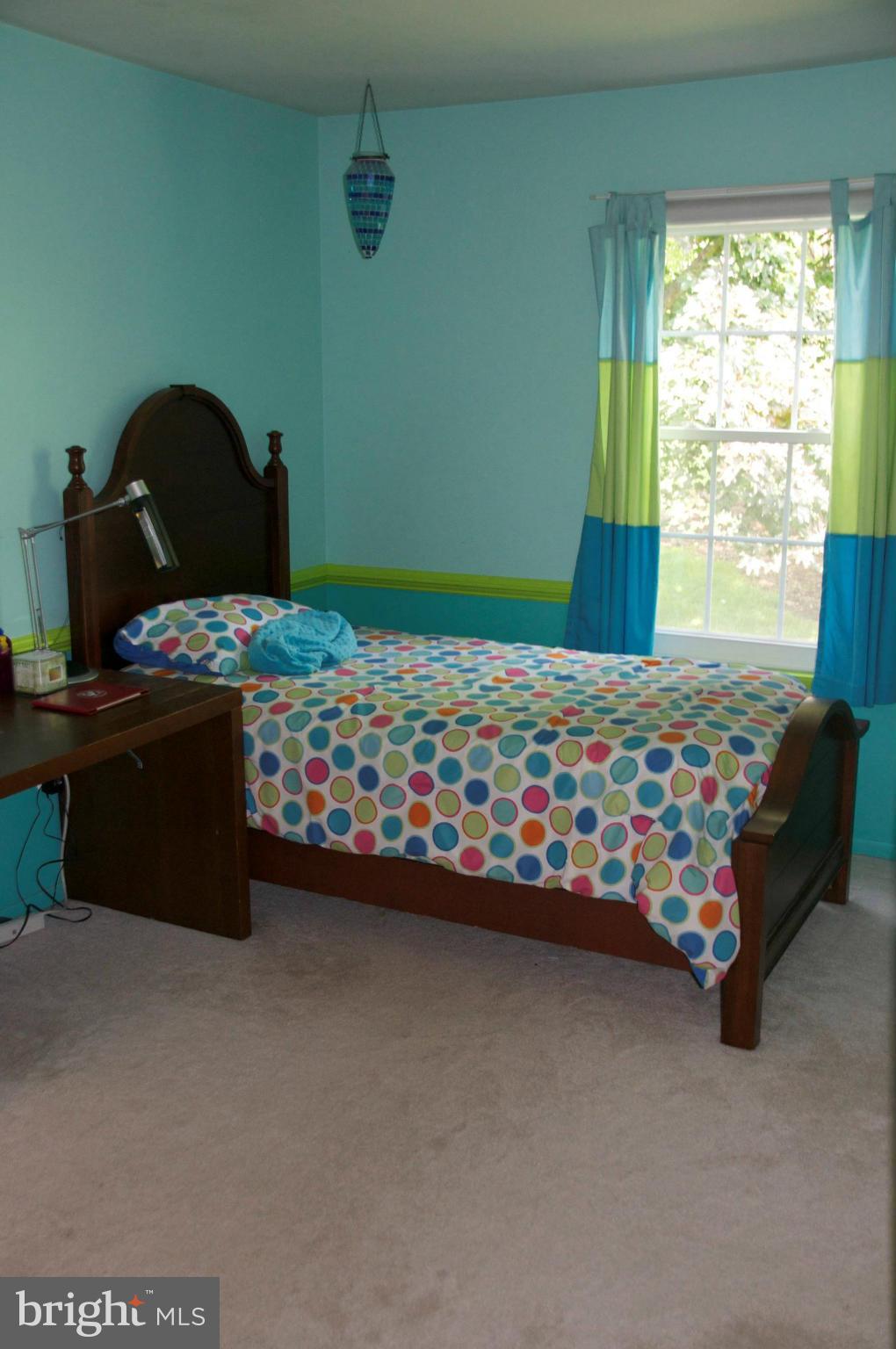 4207 Jackson Mill Road Haymarket, VA 20169 - Photo 12 of 30 a bed sitting in a bedroom next to a window