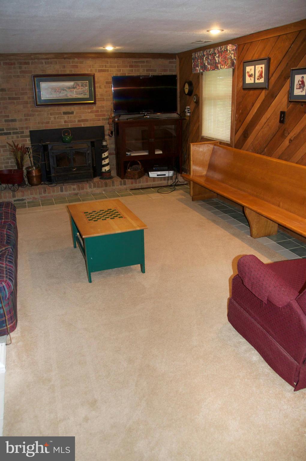 4207 Jackson Mill Road Haymarket, VA 20169 - Photo 16 of 30 a living room with furniture flat screen tv and fireplace