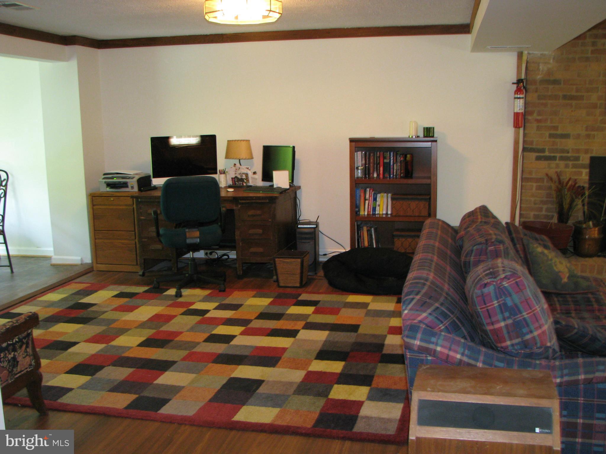 4207 Jackson Mill Road Haymarket, VA 20169 - Photo 17 of 30 a bedroom with a bed and wooden floor