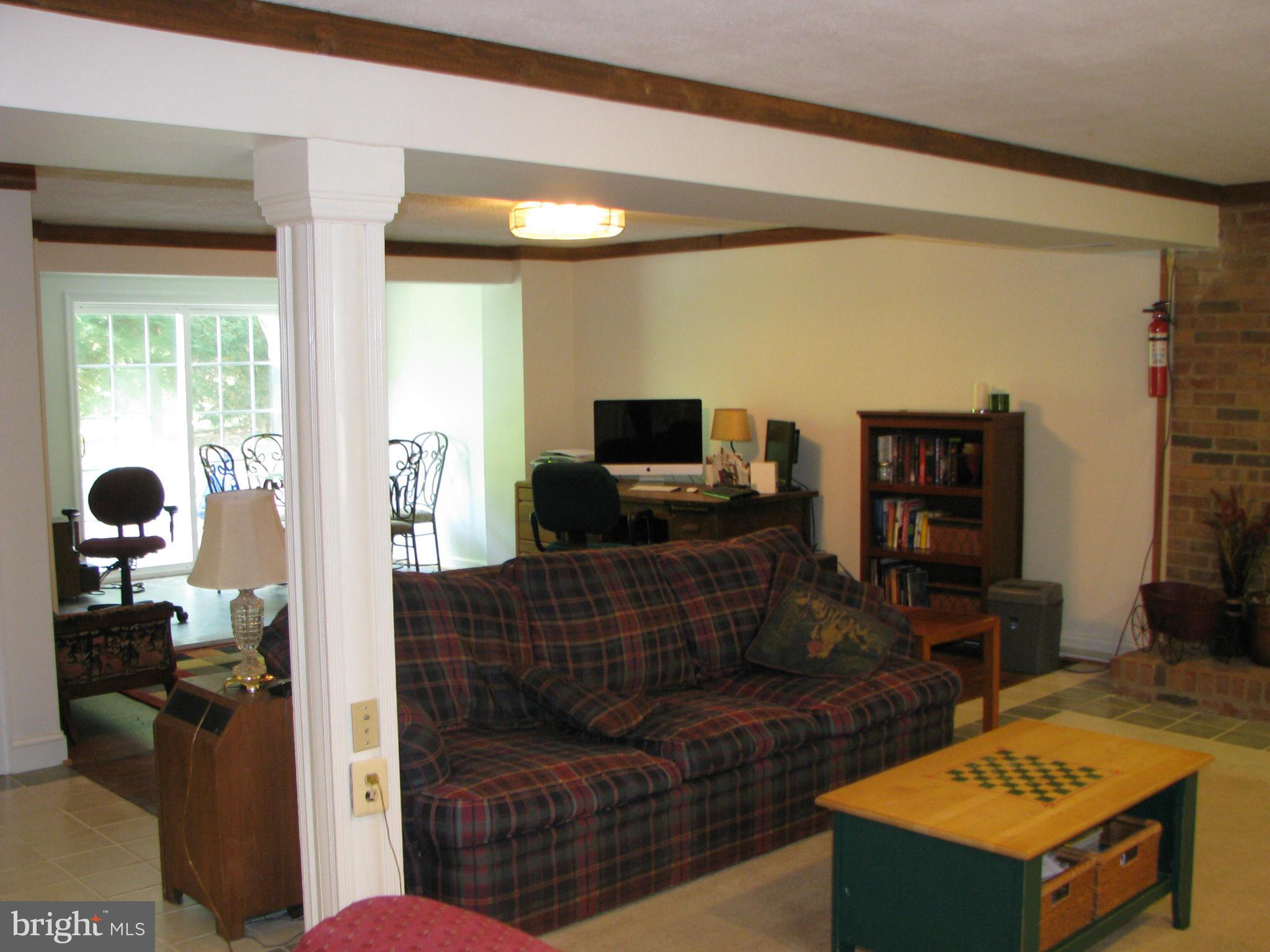 4207 Jackson Mill Road Haymarket, VA 20169 - Photo 18 of 30 a living room with furniture and a flat screen tv