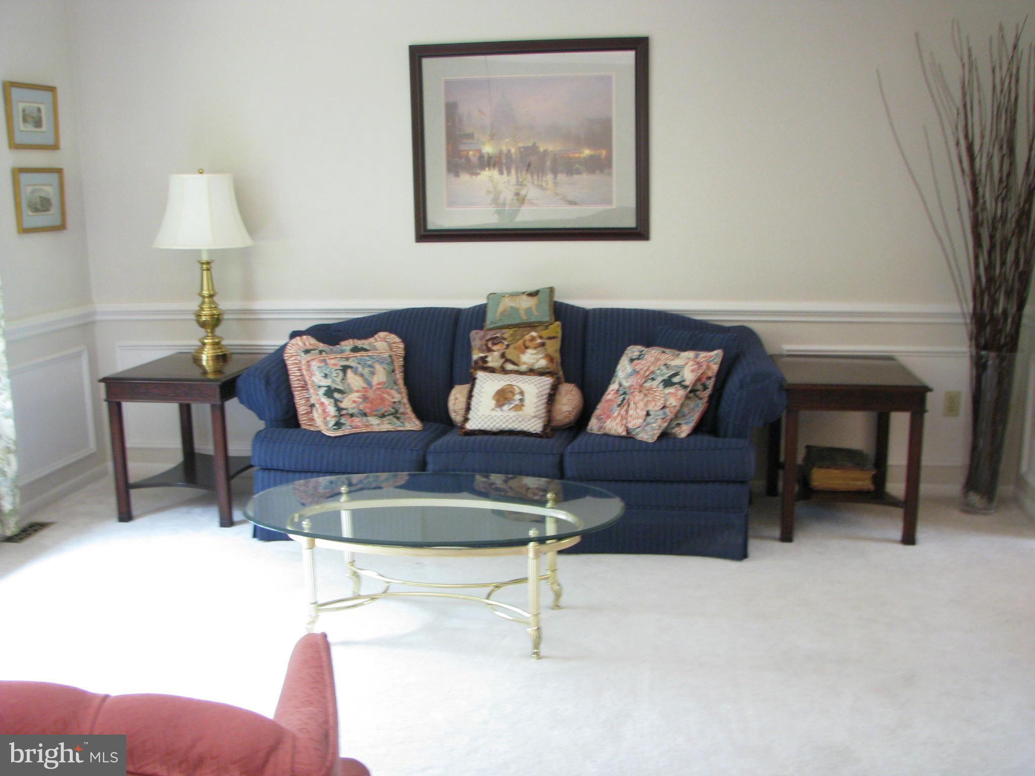4207 Jackson Mill Road Haymarket, VA 20169 - Photo 3 of 30 a living room with furniture and a lamp