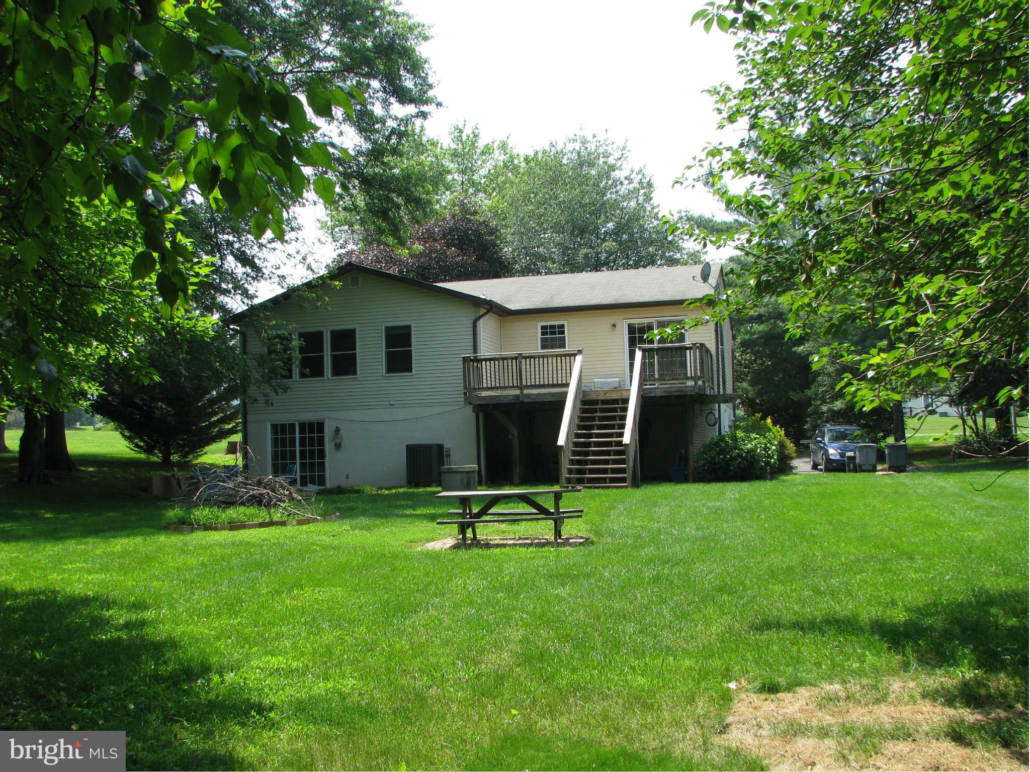 4207 Jackson Mill Road Haymarket, VA 20169 - Photo 24 of 30 a view of a house with a backyard