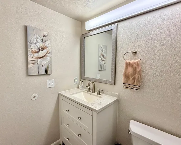 a bathroom with a toilet and a bathtub