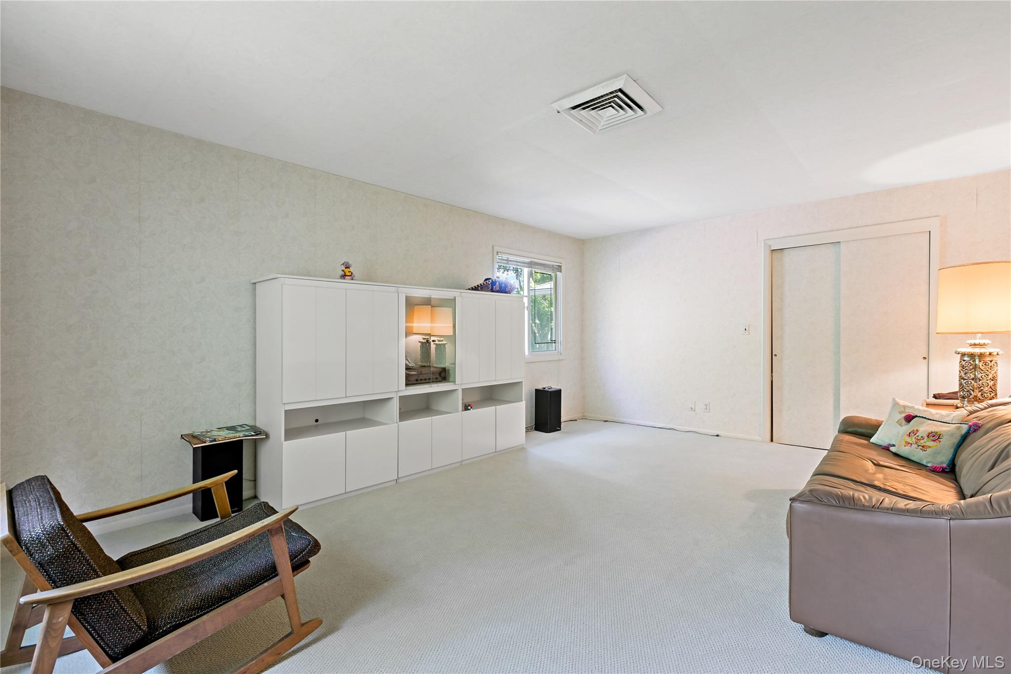16 Meadow Road Scarsdale, NY 10583 - Photo 27 of 47 a view of a livingroom with a couch and a window