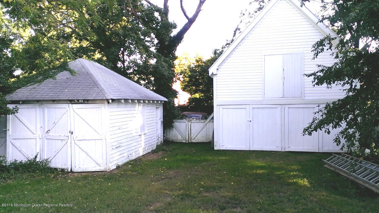 80 Elizabeth Street Keyport, NJ 07735 - Photo 6 of 6 a view of backyard with small cabin and wooden fence