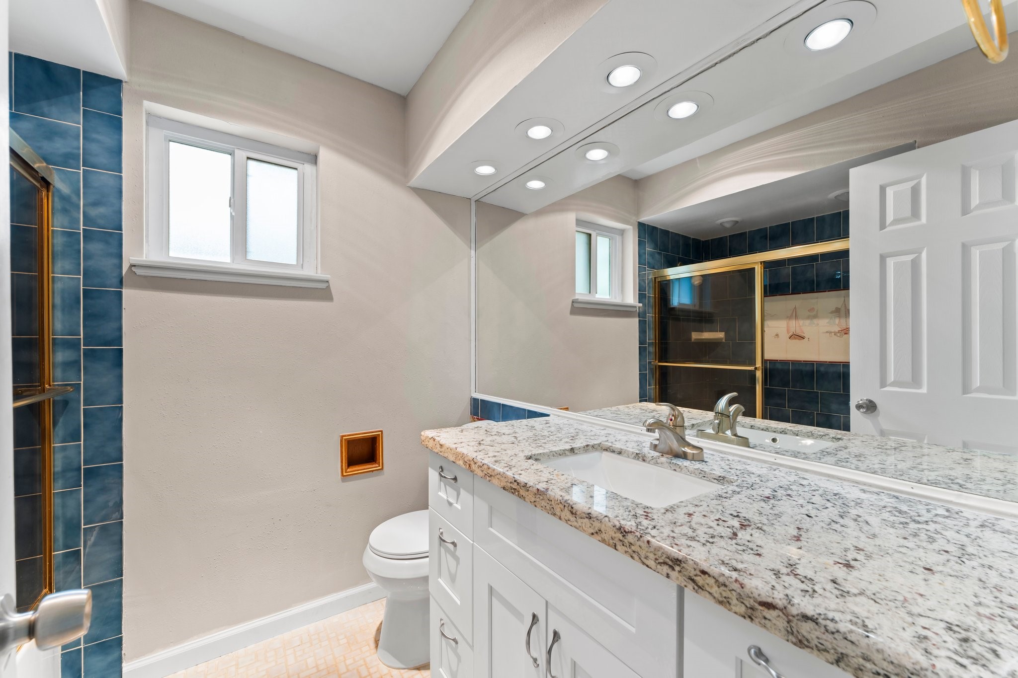 3527 Acorn Way Lane Spring, TX 77389 - Photo 11 of 26 a bathroom with a granite countertop sink a toilet and a large mirror