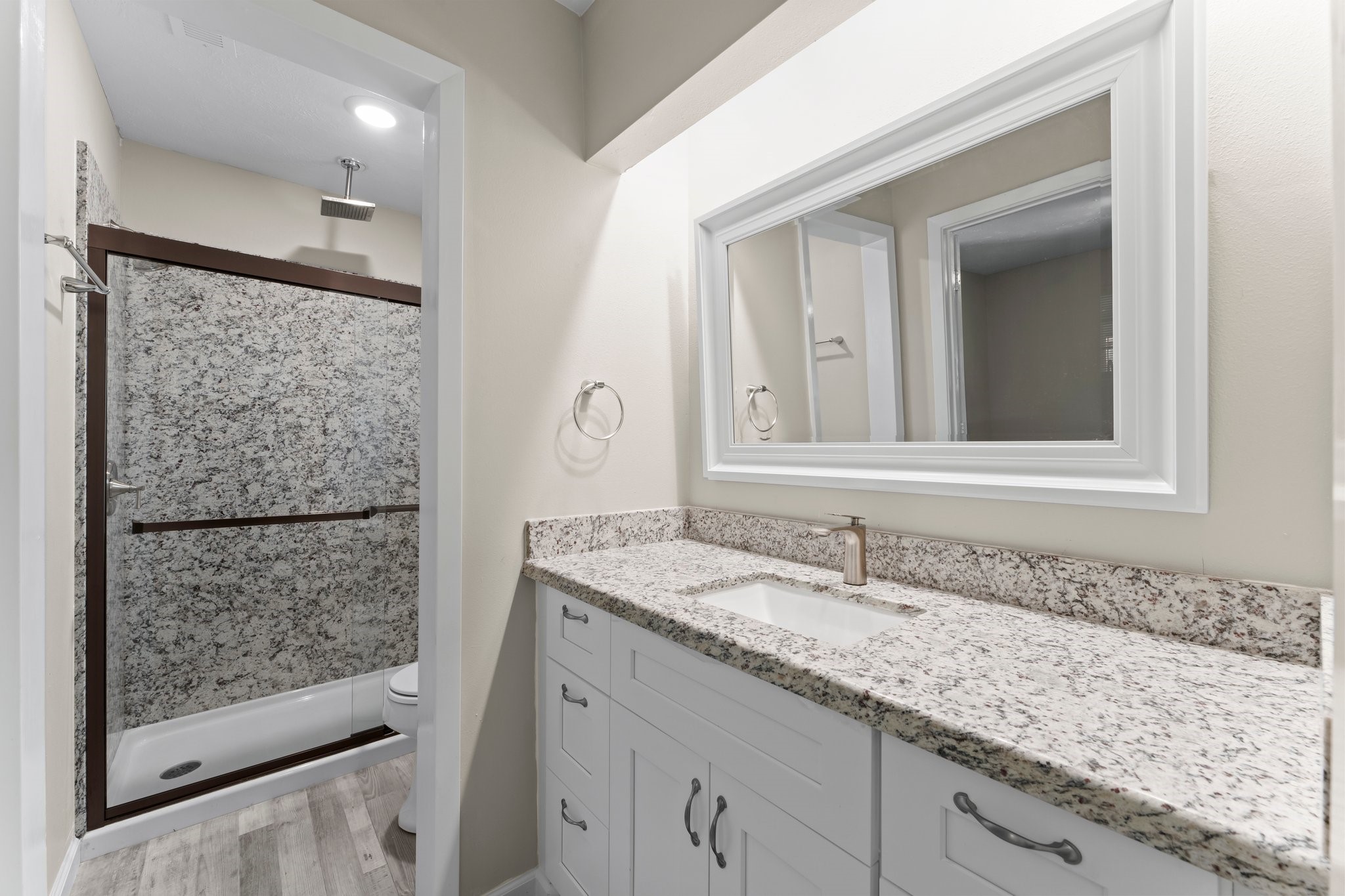 3527 Acorn Way Lane Spring, TX 77389 - Photo 18 of 26 a bathroom with a granite countertop sink and a mirror