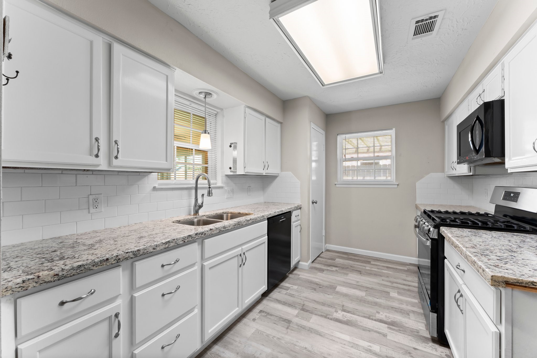 3527 Acorn Way Lane Spring, TX 77389 - Photo 7 of 26 a kitchen with granite countertop cabinets stainless steel appliances a sink and a window
