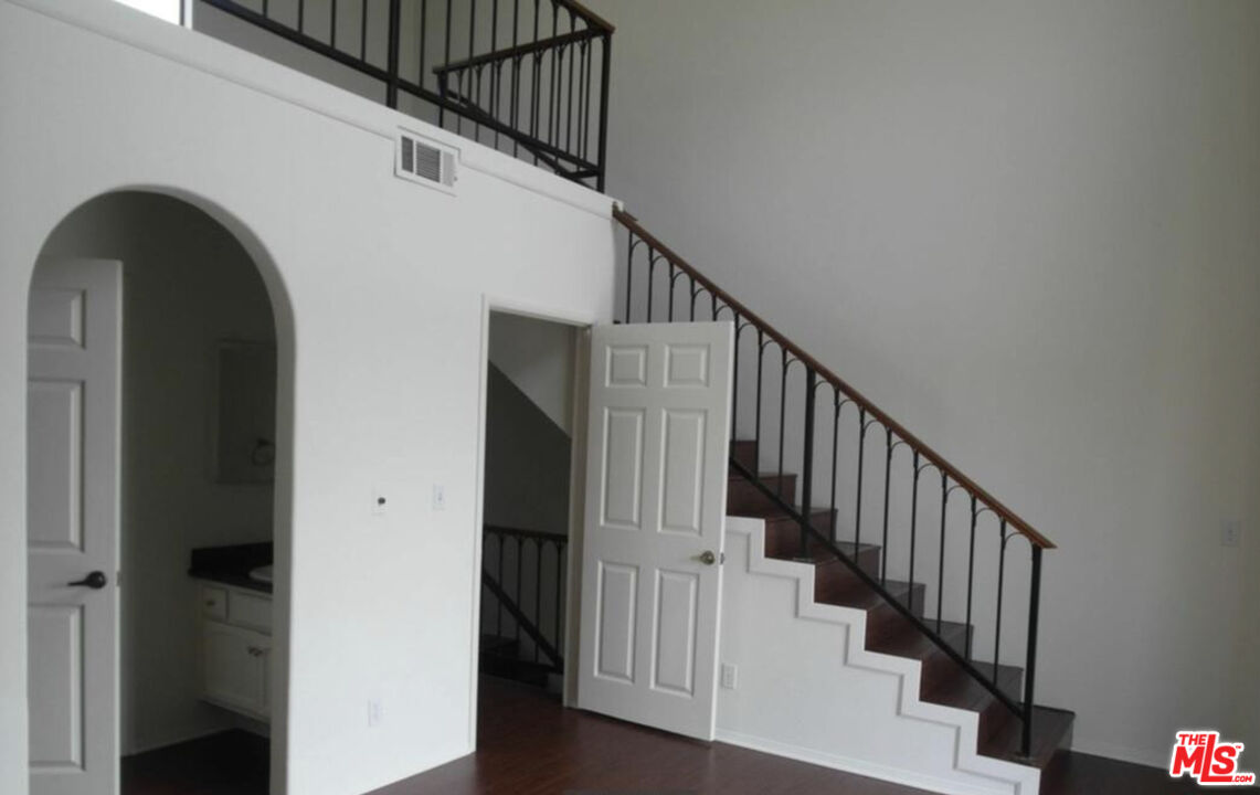 2480 Penmar Avenue, Unit 2 Venice, CA 90291 - Photo 3 of 8 a view of staircase with wooden floor and white walls